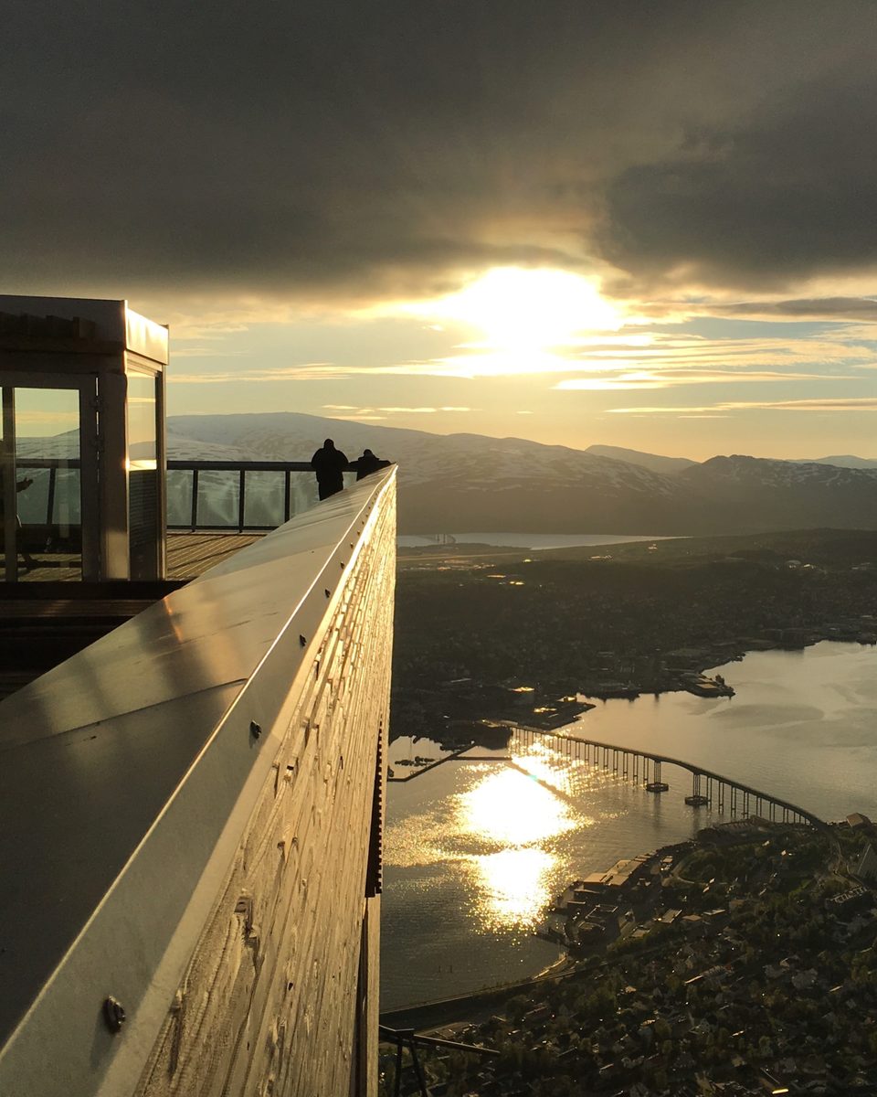 Tromsø, its bridge and the fjord from Storsteinen under the low summer sun